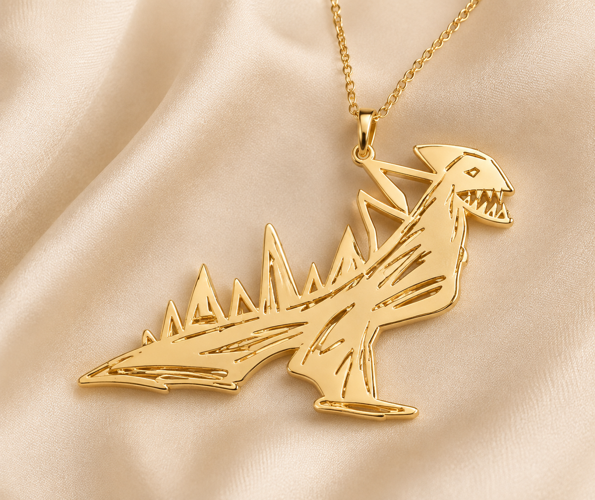 Gouden ketting met De Stekeldino uit Noahs schetsboek